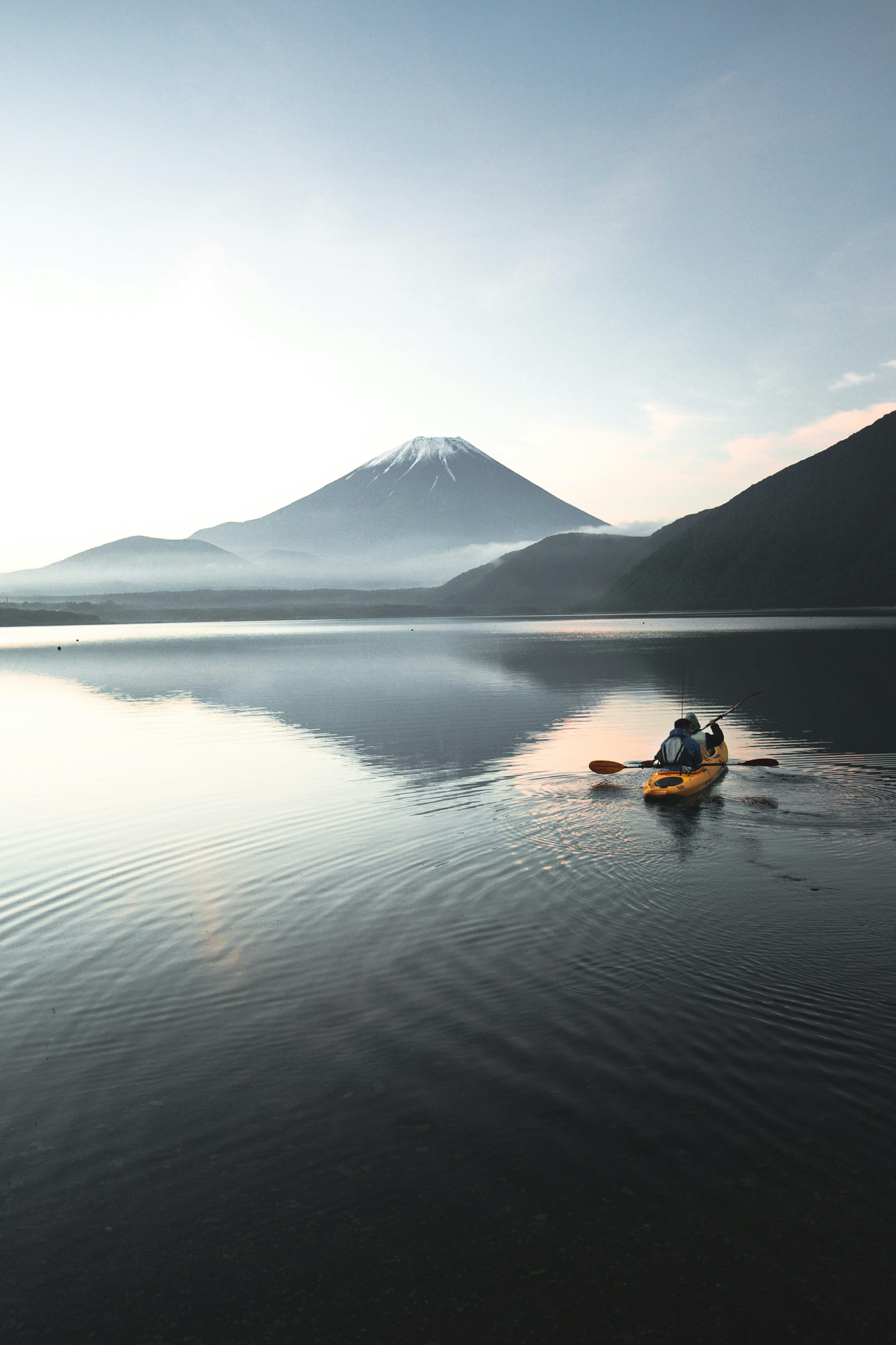 Couple enjoying Mount Fuji view at golden hour during their Japan journey